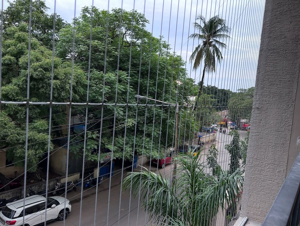 Custom invisible grills for high-rise residential balconies in Bengaluru by Renu Invisible Grills