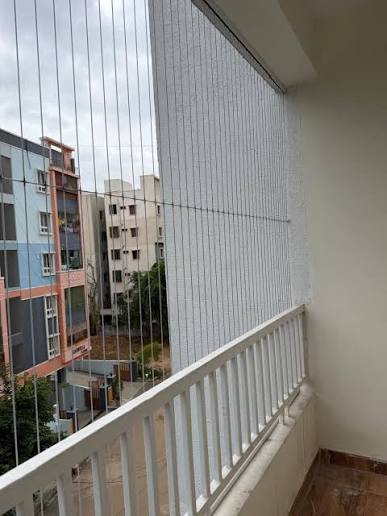 Stainless steel balcony and window invisible grills in Bommanahalli by Renu Invisible Grills
