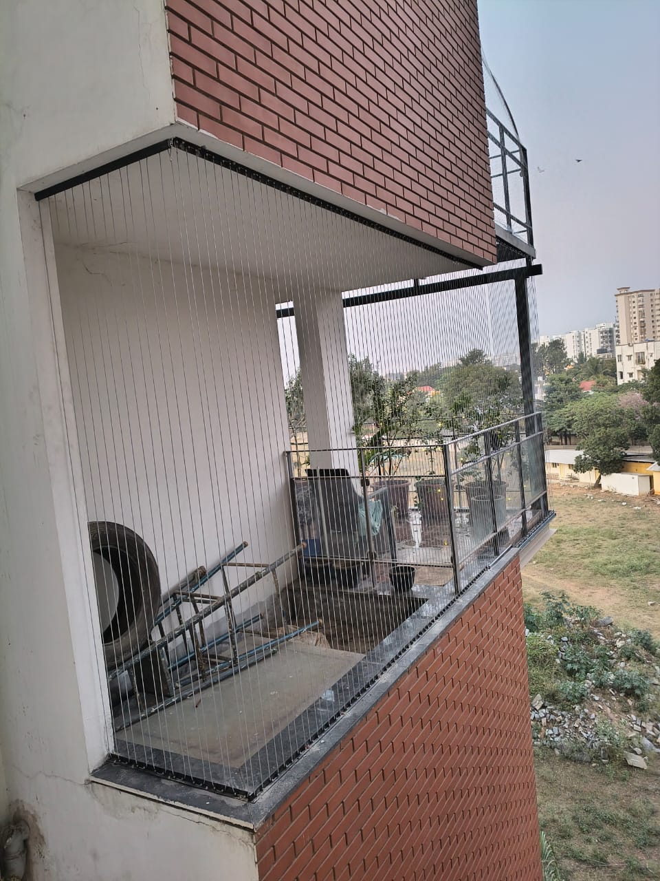 Balcony invisible grills in Bengaluru installed by Renu Invisible Grills for residential balcony openings